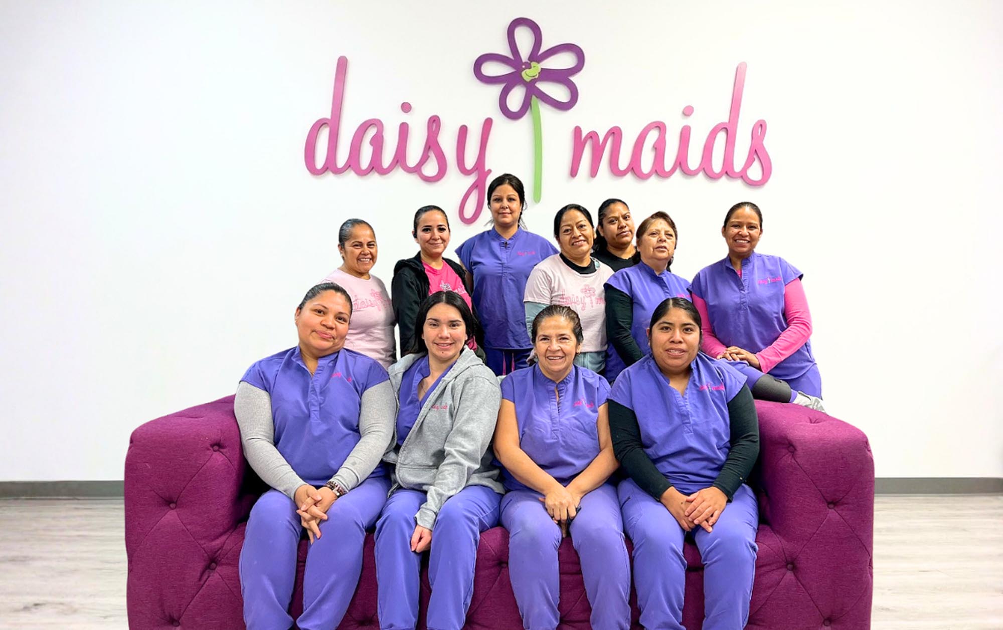 A logo for Daisy Maids, a cleaning service based in San Antonio, featuring a daisy flower design.