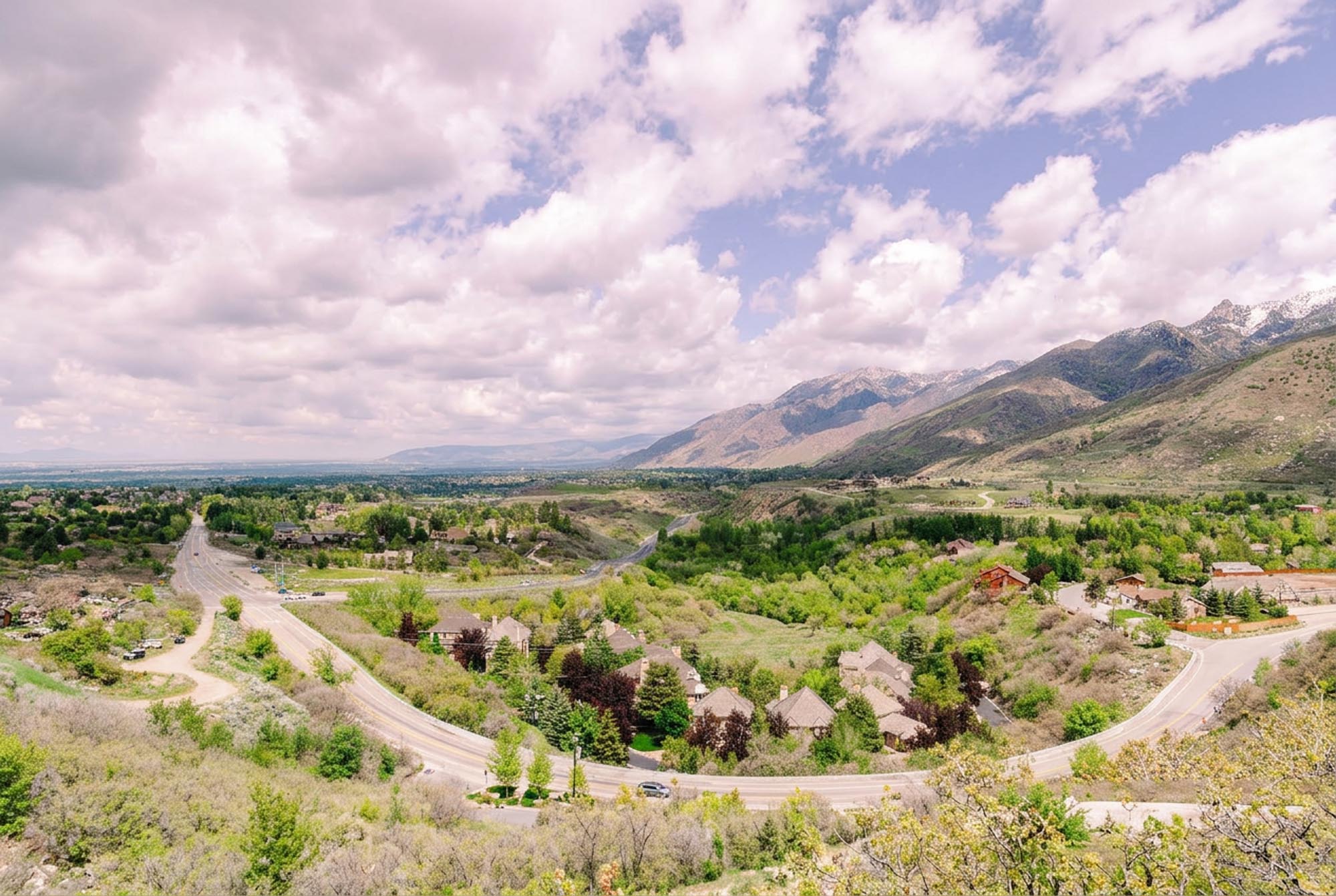 Aerial view of a football stadium surrounded by mountains, showcasing the natural landscape and sports venue in Orem.