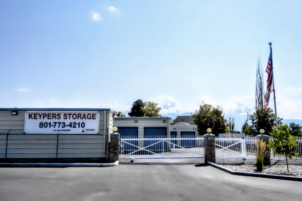 Front entrance of Keypers Storage facility, featuring a large sign and double doors.