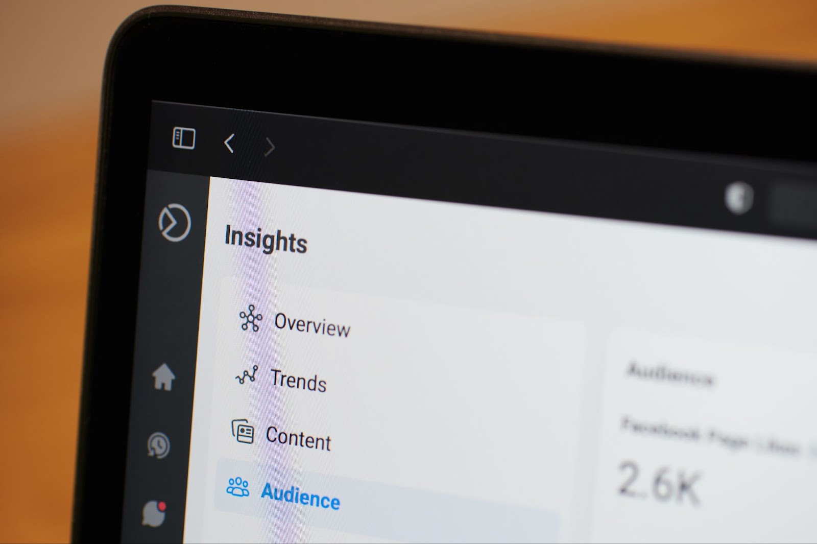 A tablet screen displaying the "Insights" section of a social media platform, with tabs for Overview, Trends, Content, and Audience, showing 2.6K followers.